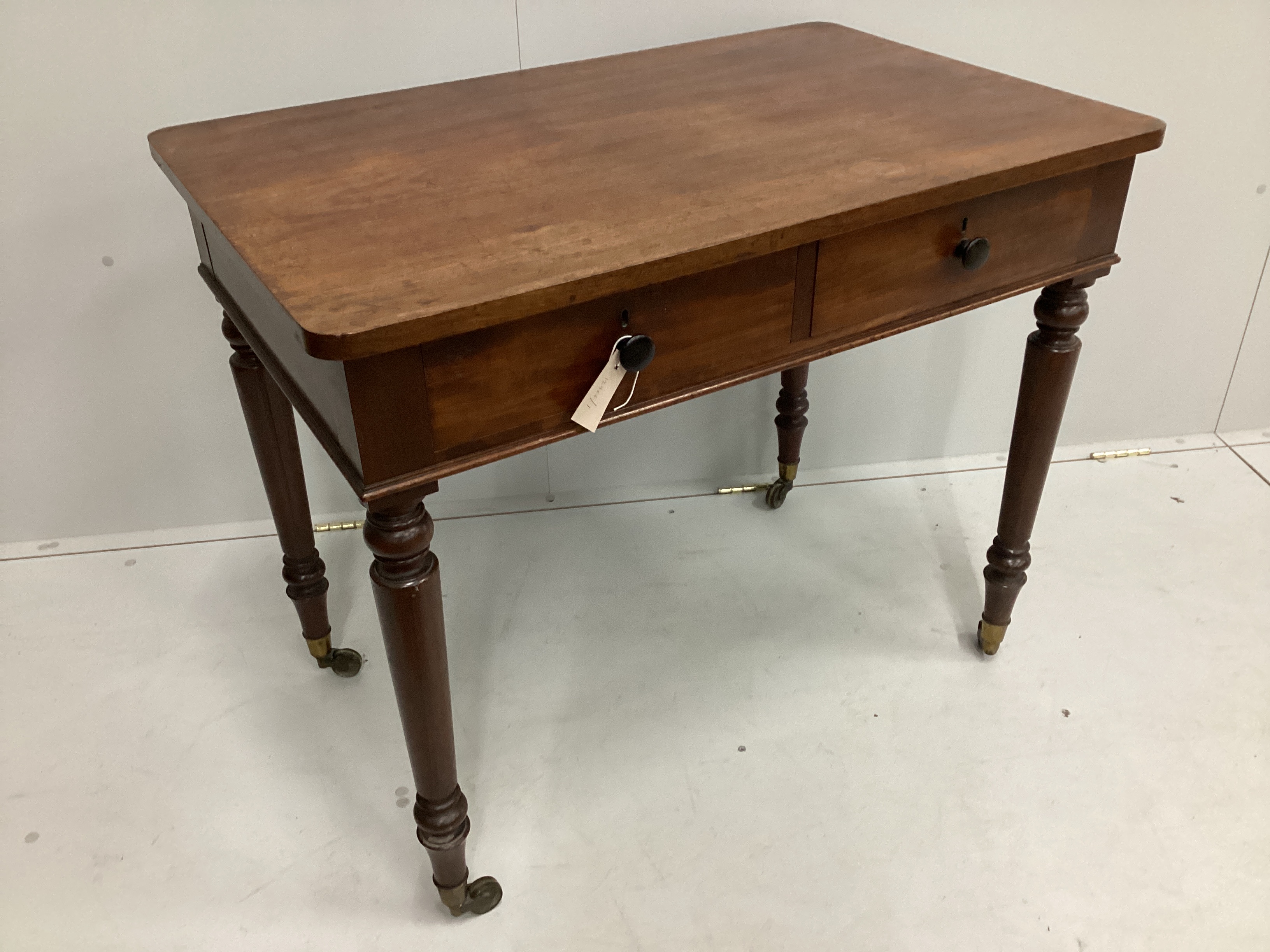 A Victorian mahogany two drawer side table, width 91cm, depth 58cm, height 75cm